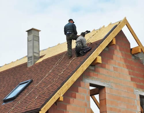 Roofer installing new roof